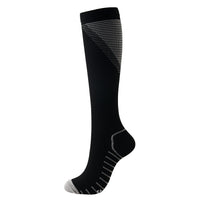 Black knee-high compression sock with grey accents, side view