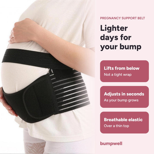 Pregnant woman wearing the black Bumpwell support belt: lifts from below, adjusts in seconds, breathable elastic