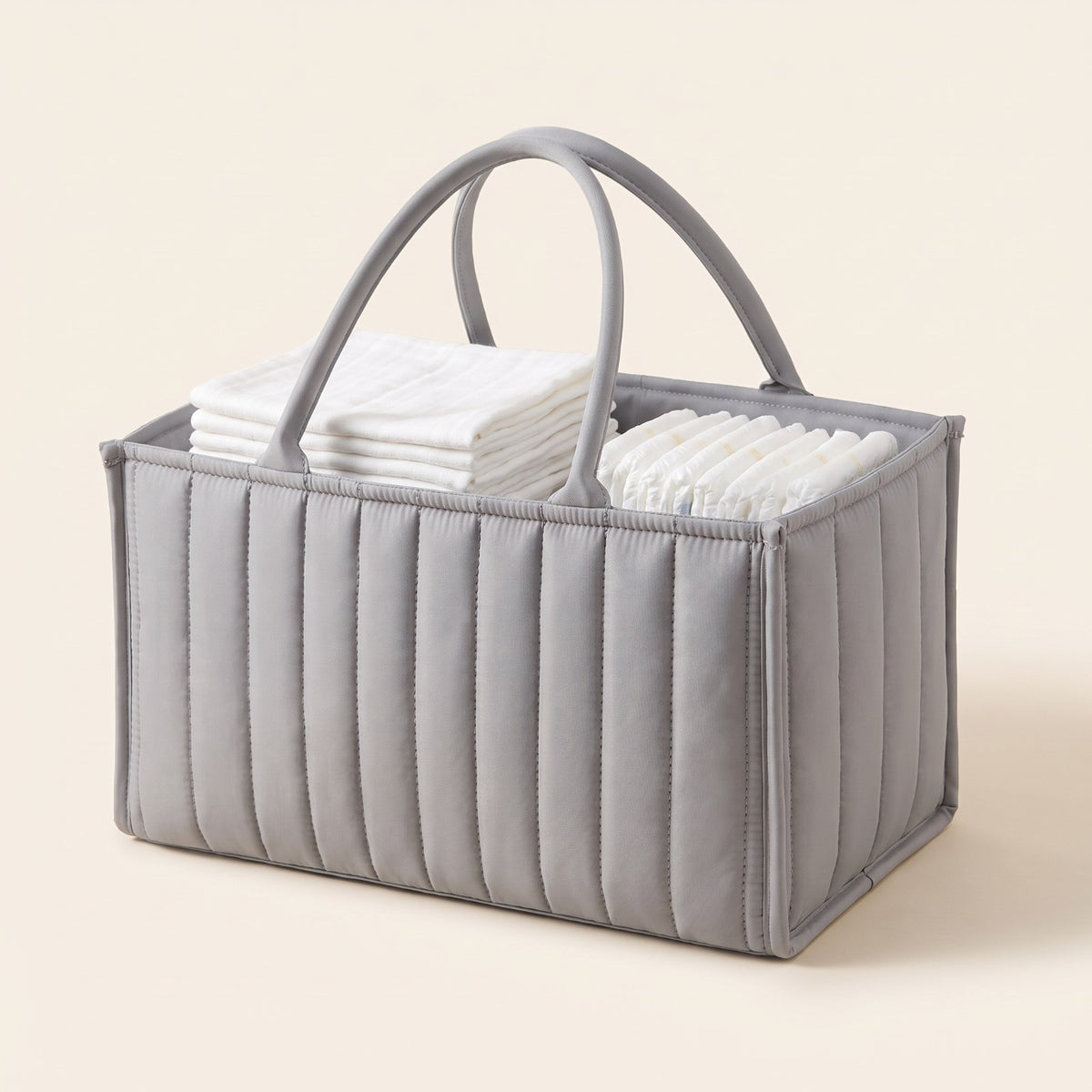 Light grey Bumpwell quilted diaper caddy organizer with carry handles