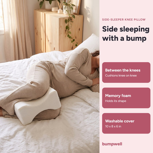 Pregnant woman side sleeping with the Bumpwell memory foam knee pillow between her knees