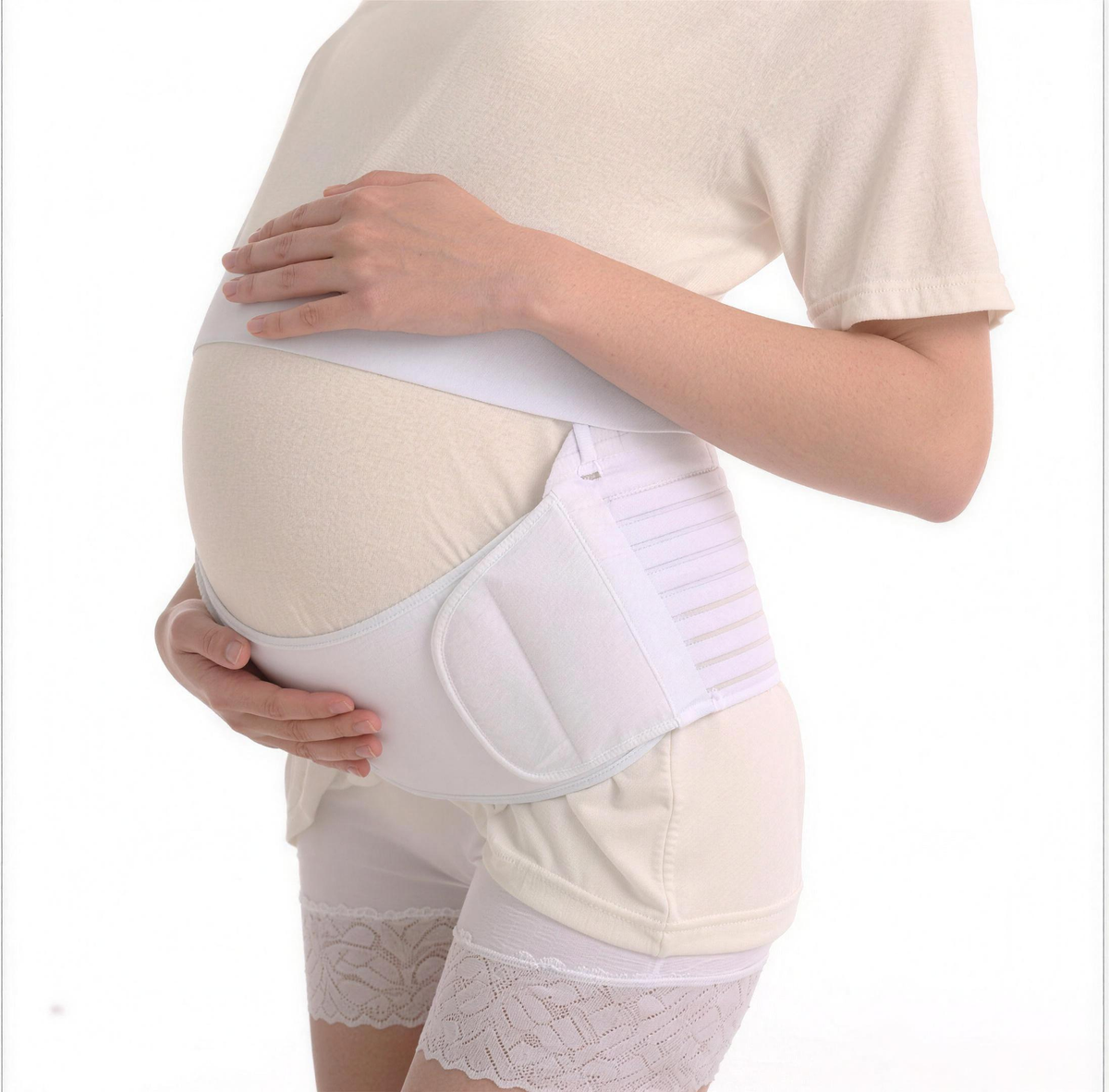 White pregnancy support belt worn under the bump, side view